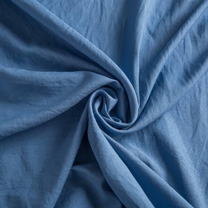 La tela textil cepillada de algodón lavado con fibra química de poliéster 100% es suave y agradable para la piel, fuerte y duradera, se pueden teñir e imprimir varios colores
